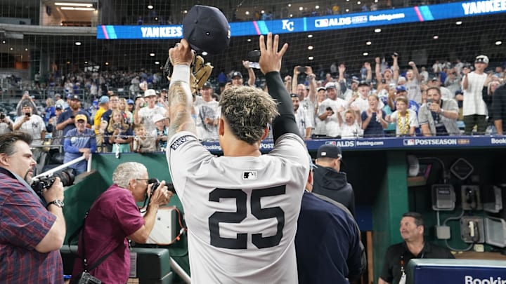 Oct 10, 2024; Kansas City, Missouri, USA; New York Yankees second baseman Gleyber Torres (25) raises his hands to fans following a win over the Kansas City Royals during game four of the ALDS for the 2024 MLB Playoffs at Kauffman Stadium. Mandatory Credit: Denny Medley-Imagn Images