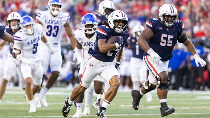 Nov 8, 2025; Tucson, Arizona, USA; Arizona Wildcats running back Quincy Craig (24) runs for a touchdown against the Kansas Jayhawks in the second half at Arizona Stadium. Mandatory Credit: Mark J. Rebilas-Imagn Images