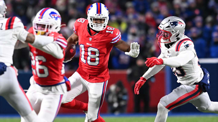 Buffalo Bills wide receiver Amari Cooper (18) stiff arms New England Patriots linebacker Christian Elliss (53) in the second quarter at Highmark Stadium in a December 2024 game. Buffalo Bills wide receiver Amari Cooper (18) stiff arms New England Patriots linebacker Christian Elliss (53) in the second quarter at Highmark Stadium in a December 2024 game.