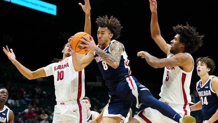 Nov 24, 2025; Las Vegas, Nevada, USA; Gonzaga Bulldogs guard Jalen Warley (8) grabs a rebound against Alabama Crimson Tide forward Amari Allen (5) and forward Keitenn Bristow (10) during the first half in a 2025 Players Era Festival group play game at MGM Grand Garden Arena. Nov 24, 2025; Las Vegas, Nevada, USA; Gonzaga Bulldogs guard Jalen Warley (8) grabs a rebound against Alabama Crimson Tide forward Amari Allen (5) and forward Keitenn Bristow (10) during the first half in a 2025 Players Era Festival group play game at MGM Grand Garden Arena.