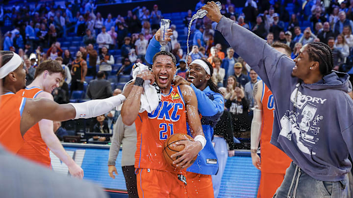 Feb 1, 2025; Oklahoma City, Oklahoma, USA; Oklahoma City Thunder guard Aaron Wiggins (21) has water poured on him by his teammates after his career high points performance against the Sacramento Kings during the second half at Paycom Center. Mandatory Credit: Alonzo Adams-Imagn Images