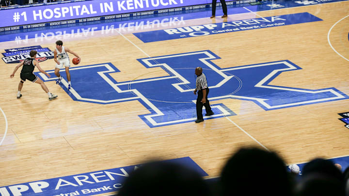 Kentucky-commit Reed Sheppard brings the ball up the court atop the large UK logo at the UK HealthCare Boys Sweet 16 tournament Wednesday at Rupp Arena. March 15, 2022

2022 Sweet Sixteen Boys Basketball Tournament