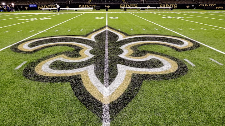 Oct 30, 2022; New Orleans, Louisiana, USA; General view of the New Orleans Saints logo as the midfield logo fleur-de-lis after the game between the New Orleans Saints and the Las Vegas Raiders at Caesars Superdome. Mandatory Credit: Stephen Lew-Imagn Images Oct 30, 2022; New Orleans, Louisiana, USA; General view of the New Orleans Saints logo as the midfield logo fleur-de-lis after the game between the New Orleans Saints and the Las Vegas Raiders at Caesars Superdome. Mandatory Credit: Stephen Lew-Imagn Images