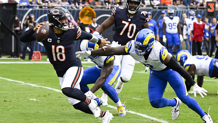 Sep 29, 2024; Chicago, Illinois, USA;  Los Angeles Rams linebacker Jared Verse (8) chases Chicago Bears quarterback Caleb Williams (18) during the first half at Soldier Field. Mandatory Credit: Matt Marton-Imagn Images