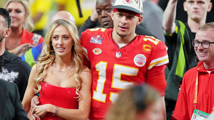 Kansas City Chiefs quarterback Patrick Mahomes (15) and his wife Brittany Mahomes walk off the field after winning Super Bowl LVIII against the San Francisco 49ers at Allegiant Stadium.