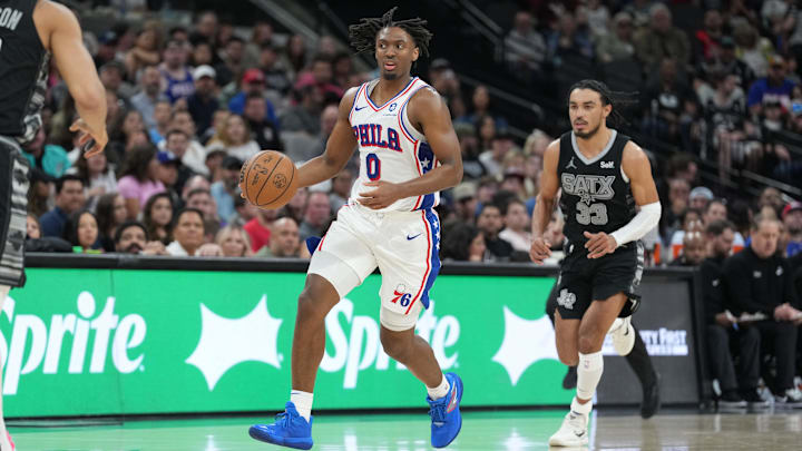 Apr 7, 2024; San Antonio, Texas, USA;  Philadelphia 76ers guard Tyrese Maxey (0) dribbles in front of San Antonio Spurs guard Tre Jones (33) in the second half at Frost Bank Center. Mandatory Credit: Daniel Dunn-Imagn Images
