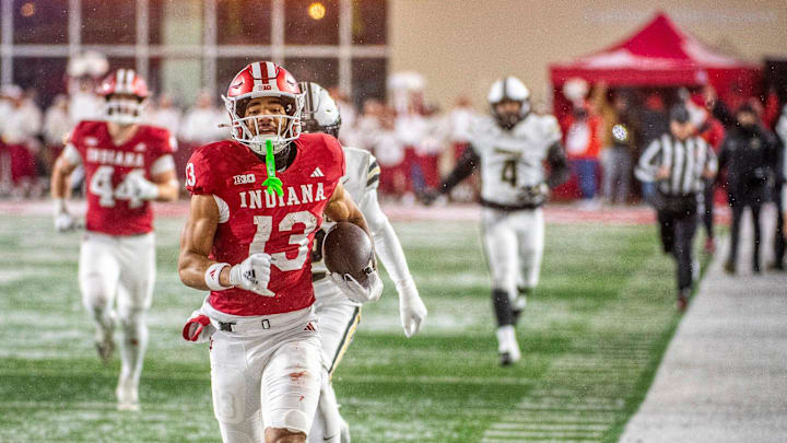 Indiana's Elijah Sarratt (13) runs for a touchdown during the Indiana versus Purdue football game at Memorial Stadium on Saturday, Nov. 30, 2024. Indiana's Elijah Sarratt (13) runs for a touchdown during the Indiana versus Purdue football game at Memorial Stadium on Saturday, Nov. 30, 2024.