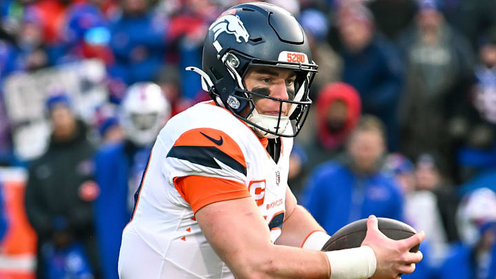 Jan 12, 2025; Orchard Park, New York, USA; Denver Broncos quarterback Bo Nix (10) runs out of the pocket in the fourth quarter of an AFC wild card game against the Buffalo Bills at Highmark Stadium. Mandatory Credit: Mark Konezny-Imagn Images Jan 12, 2025; Orchard Park, New York, USA; Denver Broncos quarterback Bo Nix (10) runs out of the pocket in the fourth quarter of an AFC wild card game against the Buffalo Bills at Highmark Stadium. Mandatory Credit: Mark Konezny-Imagn Images