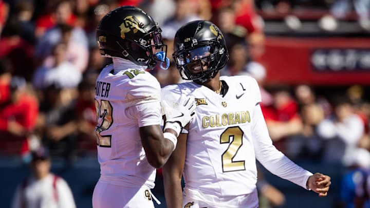 Colorado Buffalos quarterback Shedeur Sanders with wide receiver Travis Hunter against the Arizona Wildcats.