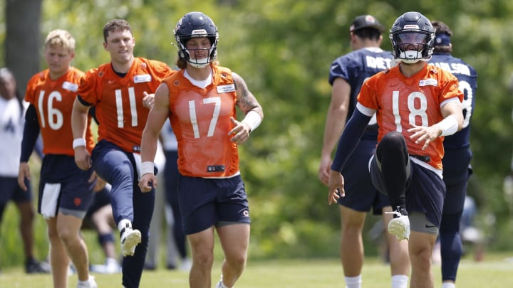 Caleb Williams (18), Tyson Bagent (17), Brett Rypien (11) and Austin Reed (16) go through warmups at Halas Hall practice. Caleb Williams (18), Tyson Bagent (17), Brett Rypien (11) and Austin Reed (16) go through warmups at Halas Hall practice.
