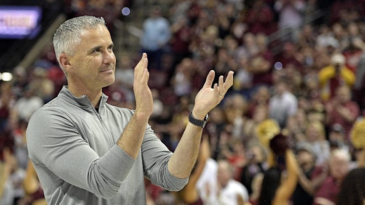 Mar 9, 2024; Tallahassee, Florida, USA; Florida State Seminoles head football coach Mike Norvell accepts the Bear Bryant coach of the Year award during a media timeout of a basketball game against the Miami Hurricanes at Donald L. Tucker Center. Mandatory Credit: Melina Myers-USA TODAY Sports