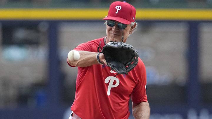 Jun 12, 2026; Milwaukee, Wisconsin, USA; Philadelphia Phillies interim manager Don Mattingly (8) fields some ball during batting practice before a game against the Milwaukee Brewers at American Family Field.