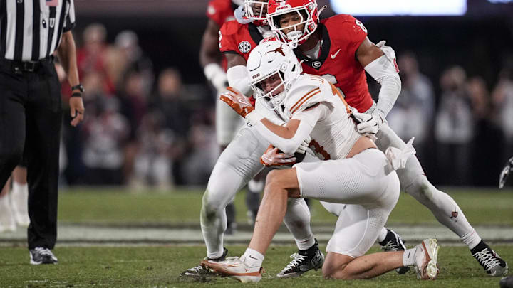 Nov 15, 2025; Athens, Georgia, USA; Georgia Bulldogs defensive back Daylen Everette (6) tackles Texas Longhorns quarterback Arch Manning (16) in the second half at Sanford Stadium. Nov 15, 2025; Athens, Georgia, USA; Georgia Bulldogs defensive back Daylen Everette (6) tackles Texas Longhorns quarterback Arch Manning (16) in the second half at Sanford Stadium.