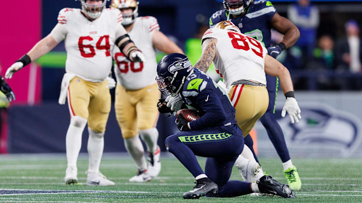 Seattle Seahawks linebacker Ernest Jones IV (13) intercepts the ball in the third quarter in an NFC Divisional Round game.