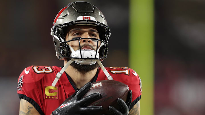 Jan 12, 2025; Tampa, Florida, USA; Tampa Bay Buccaneers wide receiver Mike Evans (13) warms up before a NFC wild card playoff against the Washington Commanders at Raymond James Stadium. Mandatory Credit: Nathan Ray Seebeck-Imagn Images