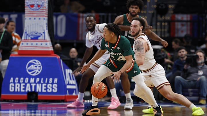 Mar 12, 2024; Washington, D.C., USA; Miami (Fl) Hurricanes guard Nijel Pack (24) dribbles the ball as Boston College Eagles guard Jaeden Zackery (3) defends in the second half at Capital One Arena. Mandatory Credit: Geoff Burke-Imagn Images