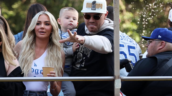 Los Angeles Dodgers first base Freddie Freeman (center) celebrates with his wife Chelsea Freeman and son on the bus during the Dodgers 2024 World Series Championship parade. Los Angeles Dodgers first base Freddie Freeman (center) celebrates with his wife Chelsea Freeman and son on the bus during the Dodgers 2024 World Series Championship parade.