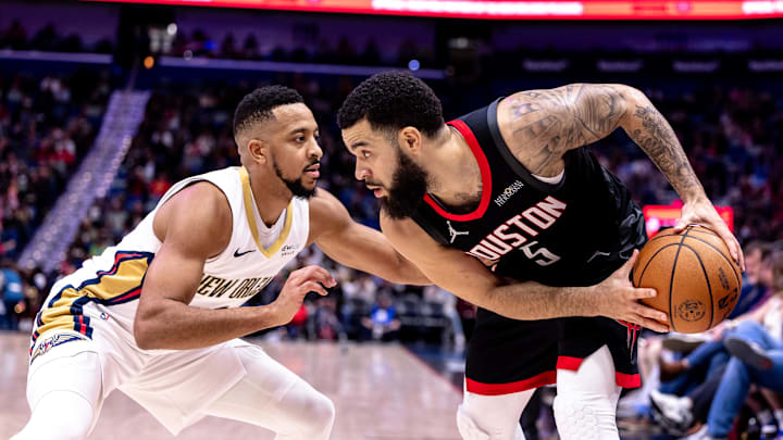 Dec 26, 2024; New Orleans, Louisiana, USA;  Houston Rockets guard Fred VanVleet (5) is guarded by New Orleans Pelicans guard CJ McCollum (3) during the first half at Smoothie King Center. Mandatory Credit: Stephen Lew-Imagn Images