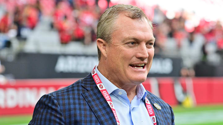 Nov 16, 2025; Glendale, Arizona, USA; San Francisco 49ers general manager John Lynch speaks on the sidelines before the game against the Arizona Cardinals at State Farm Stadium. Mandatory Credit: Matt Kartozian-Imagn Images