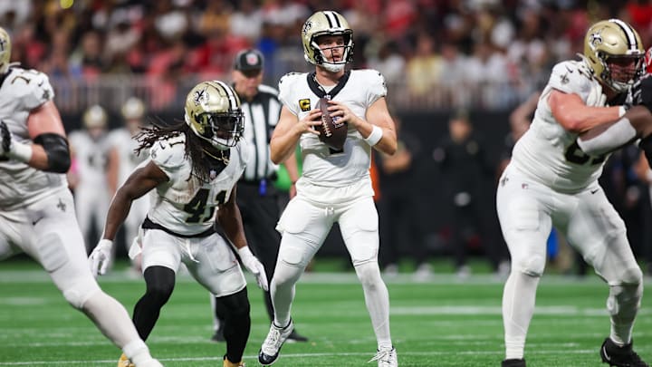 New Orleans Saints quarterback Derek Carr (4) drops back to pass against the Atlanta Falcons New Orleans Saints quarterback Derek Carr (4) drops back to pass against the Atlanta Falcons
