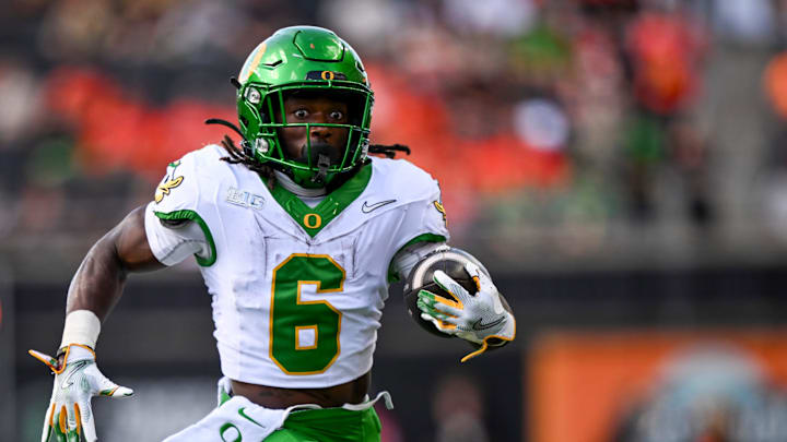 Oregon Ducks running back Noah Whittington (6) runs the ball to score a touchdown during the annual rivalry game against the Oregon State Beavers on Saturday, Sept. 14, 2024 at Reser Stadium in Corvallis, Ore.