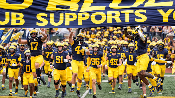 Michigan players enter the field for their game against Central Michigan at Michigan Stadium.