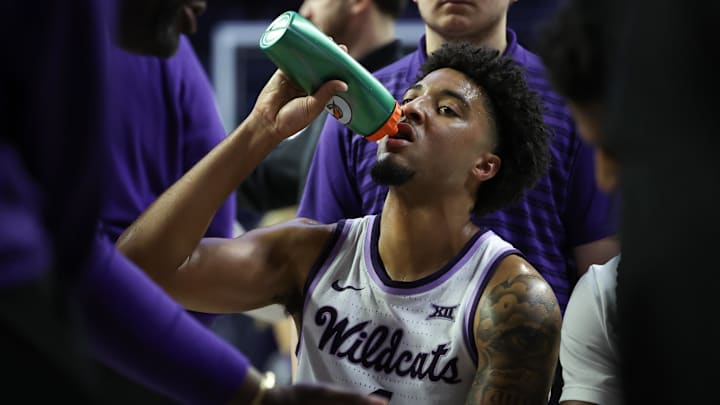Feb 28, 2026; Manhattan, Kansas, USA; Kansas State Wildcats guard P.J. Haggerty (4) takes a drink during a break in the second half against the TCU Horned Frogs at Bramlage Coliseum. 
