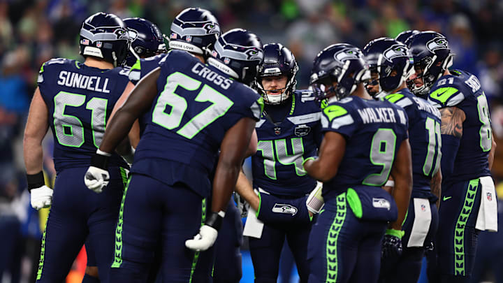 Jan 17, 2026; Seattle, WA, USA; Seattle Seahawks quarterback Sam Darnold (14) in the huddle against the San Francisco 49ers during the first half in an NFC Divisional Round game at Lumen Field. Mandatory Credit: Kevin Ng-Imagn Images Jan 17, 2026; Seattle, WA, USA; Seattle Seahawks quarterback Sam Darnold (14) in the huddle against the San Francisco 49ers during the first half in an NFC Divisional Round game at Lumen Field. Mandatory Credit: Kevin Ng-Imagn Images