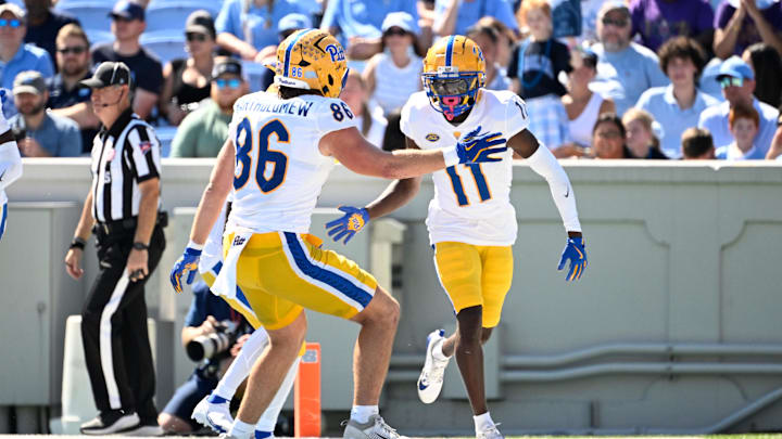 Oct 5, 2024; Chapel Hill, North Carolina, USA;  Pittsburgh Panthers wide reciever Censere Lee (11) celebrates with tight end Gavin Bartholomew (86) after scoring a touchdown in the second quarter at Kenan Memorial Stadium. Mandatory Credit: Bob Donnan-Imagn Images