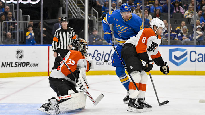 Nov 14, 2025; St. Louis, Missouri, USA; Philadelphia Flyers goaltender Samuel Ersson (33) and defenseman Cam York (8) defend the net against St. Louis Blues left wing Pavel Buchnevich (89) during the second period at Enterprise Center. Mandatory Credit: Jeff Curry-Imagn Images