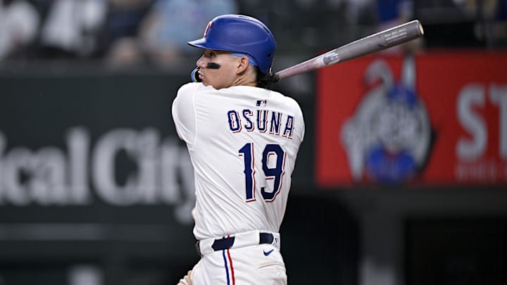 Jul 2, 2025; Arlington, Texas, USA; Texas Rangers left fielder Alejandro Osuna (19) bats during the game between the Texas Rangers and the Baltimore Orioles at Globe Life Field.