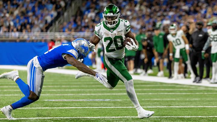 New York Jets running back Breece Hall (20) runs with the ball against Detroit Lions cornerback D.J. Reed (4) during the game at Ford Field. New York Jets running back Breece Hall (20) runs with the ball against Detroit Lions cornerback D.J. Reed (4) during the game at Ford Field.