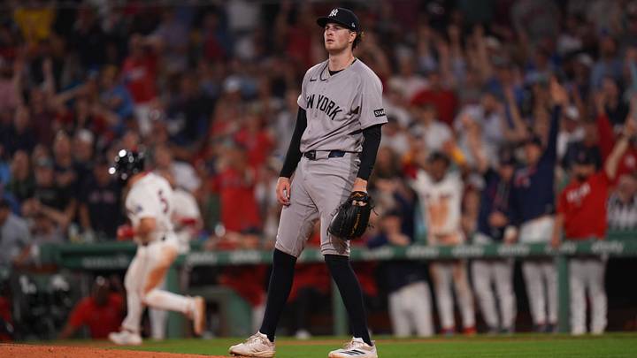 New York Yankees pitcher Cam Schlittler (31) looks on as Boston Red Sox third baseman Caleb Durbin (5) hits a two run home run in the fifth inning at Fenway Park.
