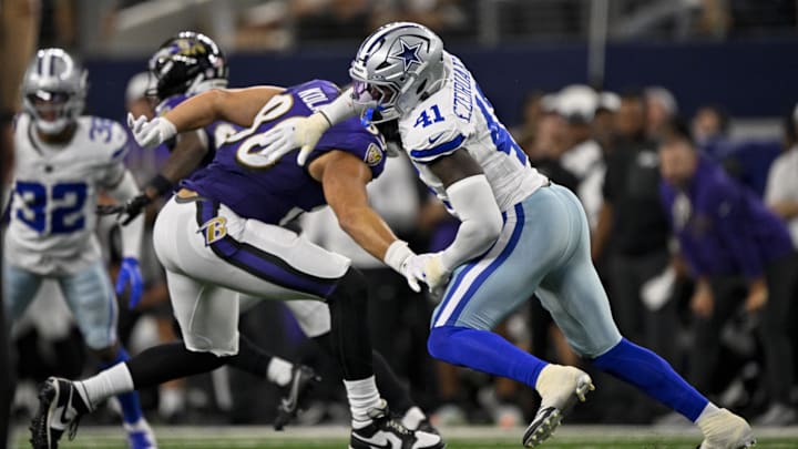 Baltimore Ravens tight end Charlie Kolar and Dallas Cowboys defensive end Donovan Ezeiruaku in action at AT&T Stadium