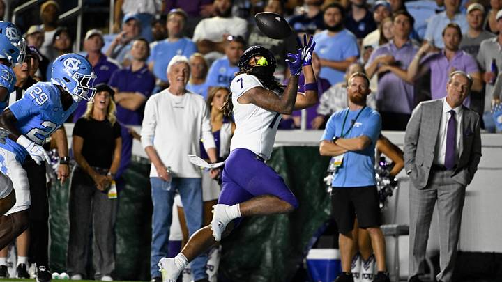Sep 1, 2025; Chapel Hill, North Carolina, USA; TCU Horned Frogs wide receiver Jordan Dwyer (7) catches a touchdown pass as North Carolina Tar Heels defensive back Marcus Allen (29) defends in the first quarter at Kenan Stadium. Mandatory Credit: Bob Donnan-Imagn Images