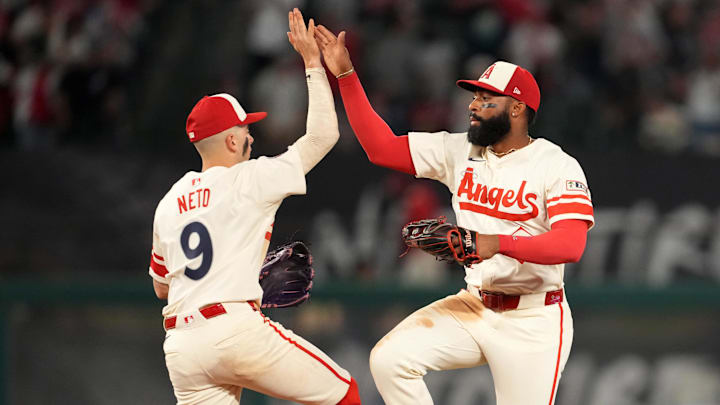 Jun 7, 2025; Anaheim, California, USA; Los Angeles Angels shortstop Zach Neto (9) and center fielder Jo Adell (7) celebrate at the end of the game against the Seattle Mariners at Angel Stadium. Mandatory Credit: Kirby Lee-Imagn Images