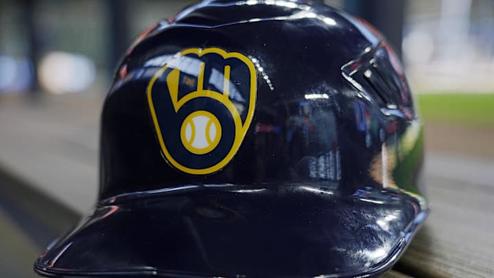 Jun 10, 2024; Milwaukee, Wisconsin, USA; A Milwaukee Brewers batting helmet sits on the bench during batting practice prior to the game against the Toronto Blue Jays at American Family Field. Mandatory Credit: Jeff Hanisch-Imagn Images Jun 10, 2024; Milwaukee, Wisconsin, USA; A Milwaukee Brewers batting helmet sits on the bench during batting practice prior to the game against the Toronto Blue Jays at American Family Field. Mandatory Credit: Jeff Hanisch-Imagn Images