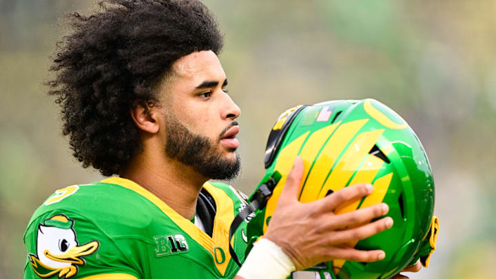 Dec 20, 2025; Eugene, OR, USA; Oregon Ducks quarterback Dante Moore (5) looks on before the game against the James Madison Dukes at Autzen Stadium. Mandatory Credit: Troy Wayrynen-Imagn Images