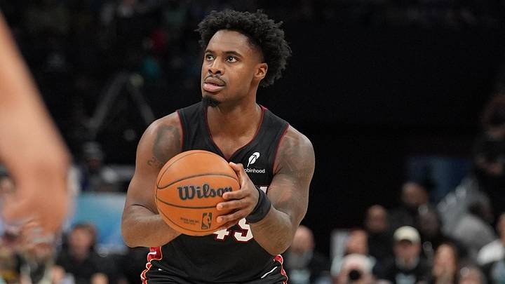 Apr 14, 2026; Charlotte, North Carolina, USA; Miami Heat guard Davion Mitchell (45) shoots the ball against the Charlotte Hornets during the second quarter during the play-in rounds between the Charlotte Hornets and the Miami Heat of the 2026 NBA Playoffs at Spectrum Center. Mandatory Credit: Jim Dedmon-Imagn Images Apr 14, 2026; Charlotte, North Carolina, USA; Miami Heat guard Davion Mitchell (45) shoots the ball against the Charlotte Hornets during the second quarter during the play-in rounds between the Charlotte Hornets and the Miami Heat of the 2026 NBA Playoffs at Spectrum Center. Mandatory Credit: Jim Dedmon-Imagn Images