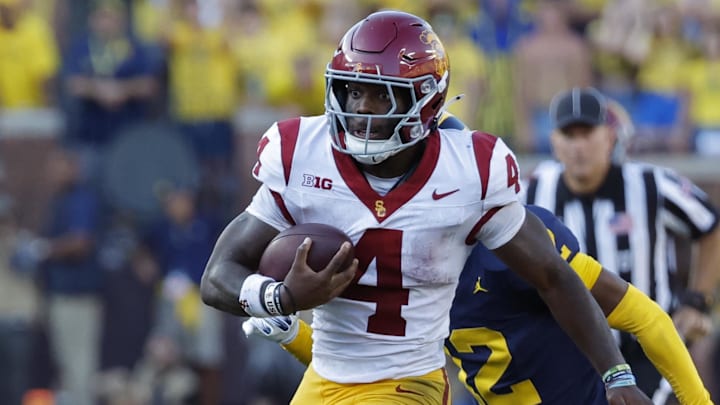 Sep 21, 2024; Ann Arbor, Michigan, USA;  USC Trojans running back Woody Marks (4) rushes against the Michigan Wolverines at Michigan Stadium. Mandatory Credit: Rick Osentoski-Imagn Images