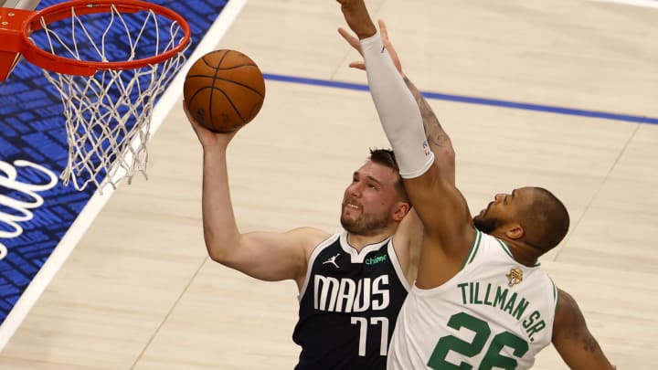 Jun 12, 2024; Dallas, Texas, USA; Dallas Mavericks guard Luka Doncic (77) shoots against Boston Celtics forward Xavier Tillman (26) during the second quarter in game three of the 2024 NBA Finals at American Airlines Center. Mandatory Credit: Peter Casey-USA TODAY Sports Jun 12, 2024; Dallas, Texas, USA; Dallas Mavericks guard Luka Doncic (77) shoots against Boston Celtics forward Xavier Tillman (26) during the second quarter in game three of the 2024 NBA Finals at American Airlines Center. Mandatory Credit: Peter Casey-USA TODAY Sports