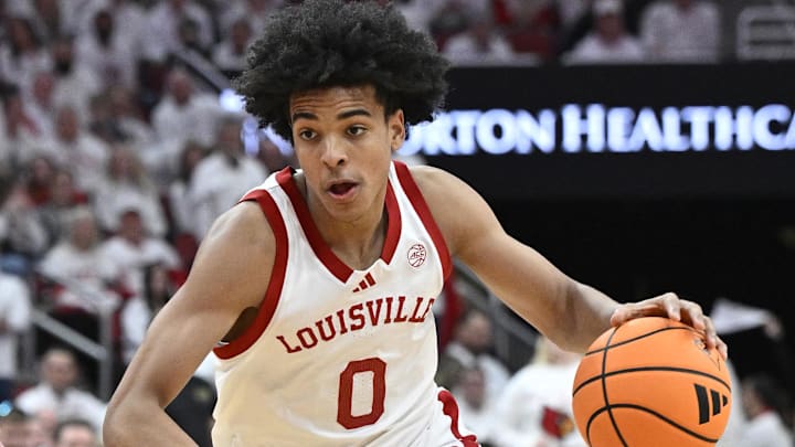 Feb 9, 2026; Louisville, Kentucky, USA;  Louisville Cardinals guard Mikel Brown Jr. (0) dribbles against the NC State Wolfpack during the second half at KFC Yum! Center. Louisville defeated N.C. State 118-77. Mandatory Credit: Jamie Rhodes-Imagn Images