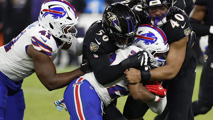 Sep 29, 2024; Baltimore, Maryland, USA; Buffalo Bills running back Ray Davis (22) is tackled by Baltimore Ravens linebacker Adisa Isaac (50) and Ravens linebacker Malik Harrison (40) at M&T Bank Stadium. Mandatory Credit: Geoff Burke-Imagn Images Sep 29, 2024; Baltimore, Maryland, USA; Buffalo Bills running back Ray Davis (22) is tackled by Baltimore Ravens linebacker Adisa Isaac (50) and Ravens linebacker Malik Harrison (40) at M&T Bank Stadium. Mandatory Credit: Geoff Burke-Imagn Images