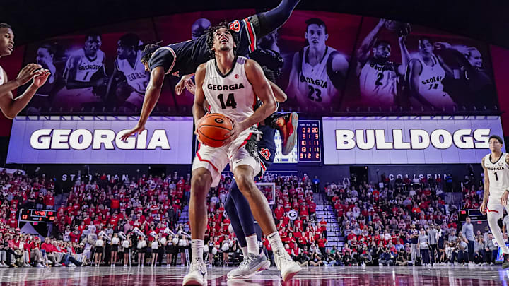 Jan 18, 2025; Athens, Georgia, USA; Auburn Tigers forward Chaney Johnson (31) flips over the back of Georgia Bulldogs forward Asa Newell (14) during the second half at Stegeman Coliseum. Mandatory Credit: Dale Zanine-Imagn Images Jan 18, 2025; Athens, Georgia, USA; Auburn Tigers forward Chaney Johnson (31) flips over the back of Georgia Bulldogs forward Asa Newell (14) during the second half at Stegeman Coliseum. Mandatory Credit: Dale Zanine-Imagn Images