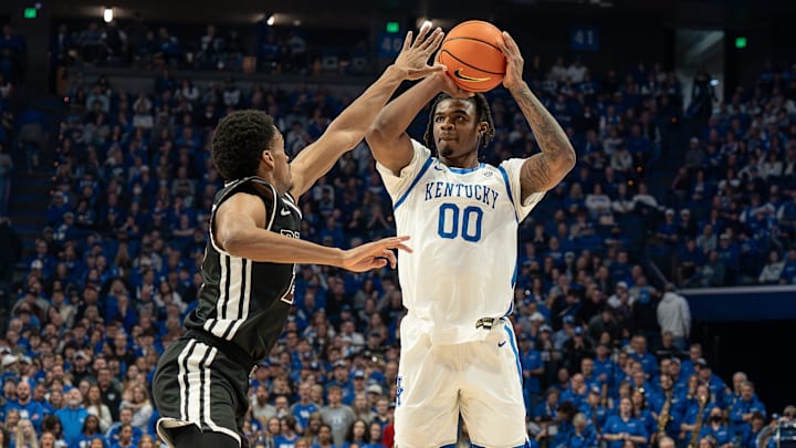 Kentucky's Otega Oweh (00) dropped in a three pointer during first half action as the Wildcats faced off against the Brown Bears at Rupp Arena on New Year's Eve, Tuesday, Dec. 31, 2024.