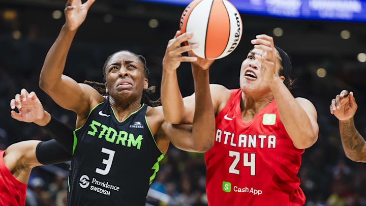Aug 13, 2025; Seattle, Washington; Atlanta Dream forward Brionna Jones (24) collects an offensive rebound against Seattle Storm forward Nneka Ogwumike (3) during the third quarter at Climate Pledge Arena. Aug 13, 2025; Seattle, Washington; Atlanta Dream forward Brionna Jones (24) collects an offensive rebound against Seattle Storm forward Nneka Ogwumike (3) during the third quarter at Climate Pledge Arena.