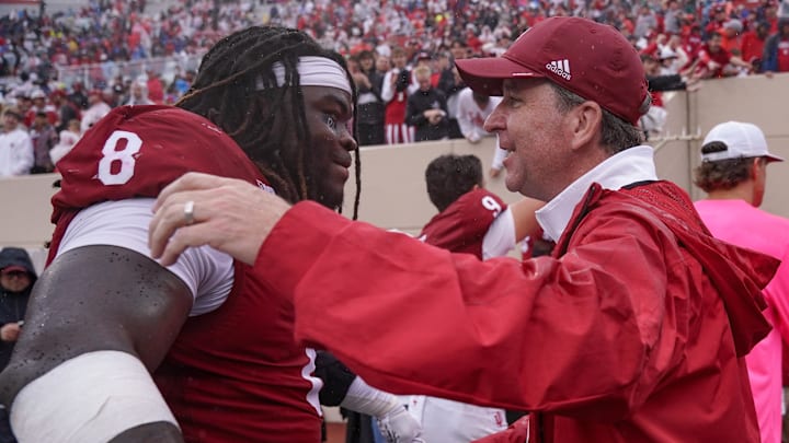 Sep 28, 2024; Bloomington, Indiana, USA;  Indiana Hoosiers defensive lineman CJ West (8) celebrates with vice president and director of intercollegiate athletics Scott Dolson after a game against the Maryland Terrapins at Memorial Stadium. Mandatory Credit: Robert Goddin-Imagn Images