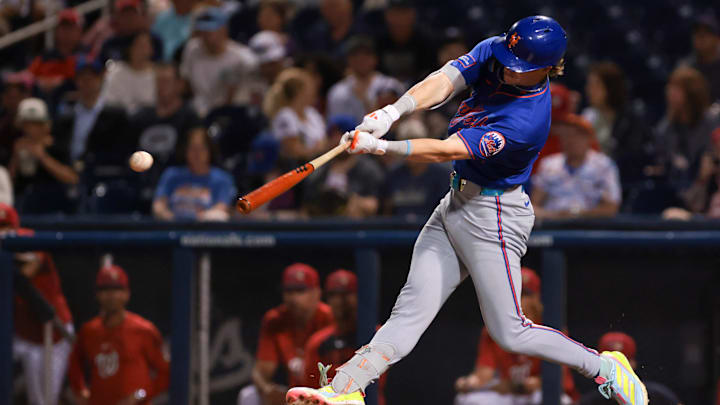 Mar 13, 2026; West Palm Beach, Florida, USA; New York Mets right fielder Carson Benge (93) hits and RBI single against the Washington Nationals during the fifth inning hits  at CACTI Park of the Palm Beaches. Mandatory Credit: Sam Navarro-Imagn Images