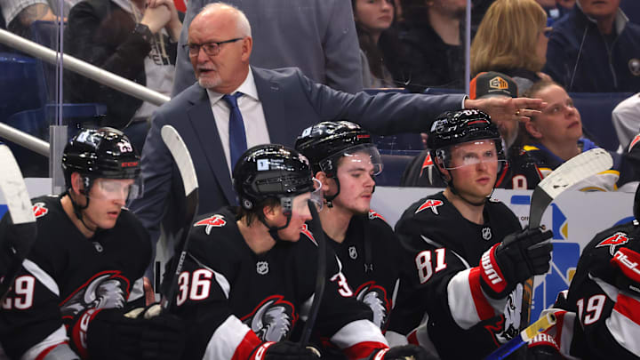 Buffalo Sabres players and head coach Lindy Ruff