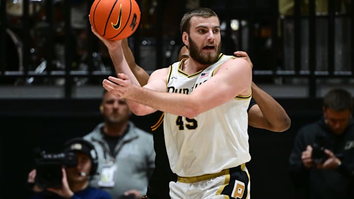 Purdue Boilermakers center Oscar Cluff (45) looks for an open teammate.